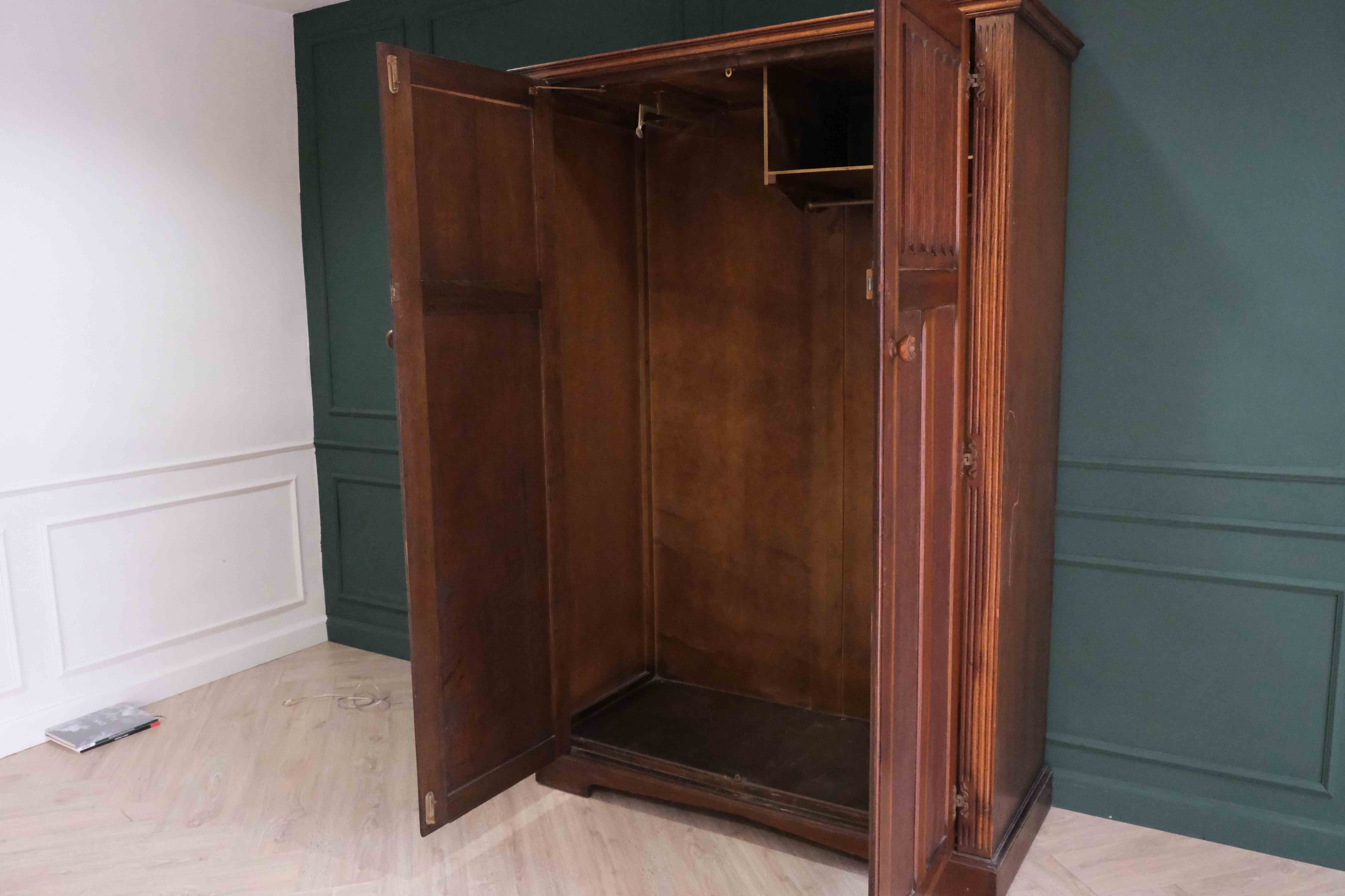 Oak wardrobe with long mirror.