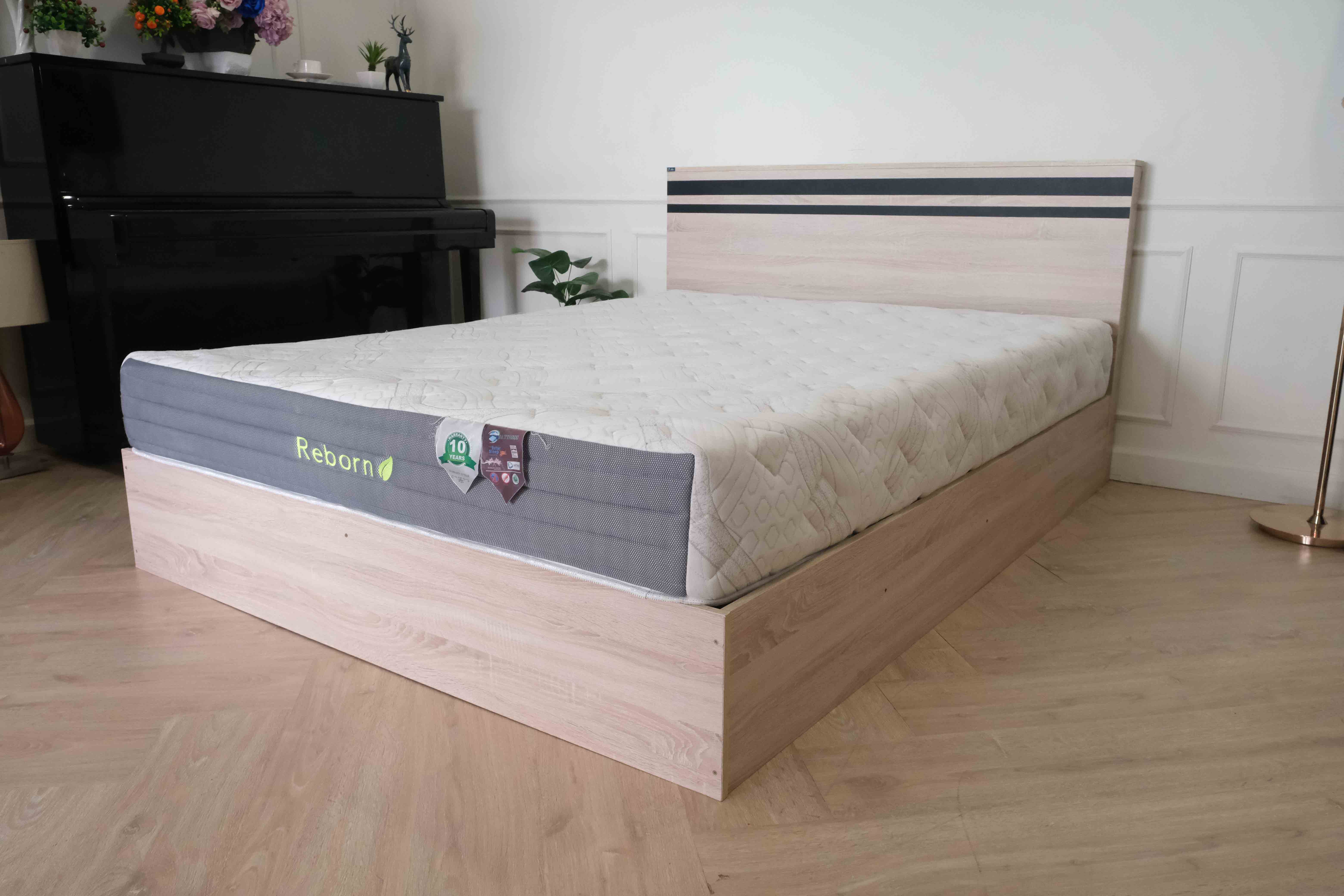 Bed brand T-DA furniture, light colored wooden frame. Black cut lines at the head of the bed, minimalist, 5 feet