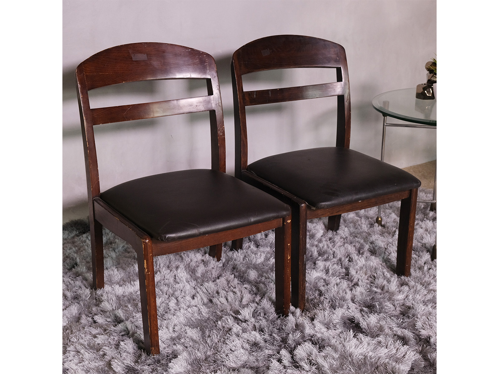 Wooden chair with dark brown fabric cushion, beautiful design.