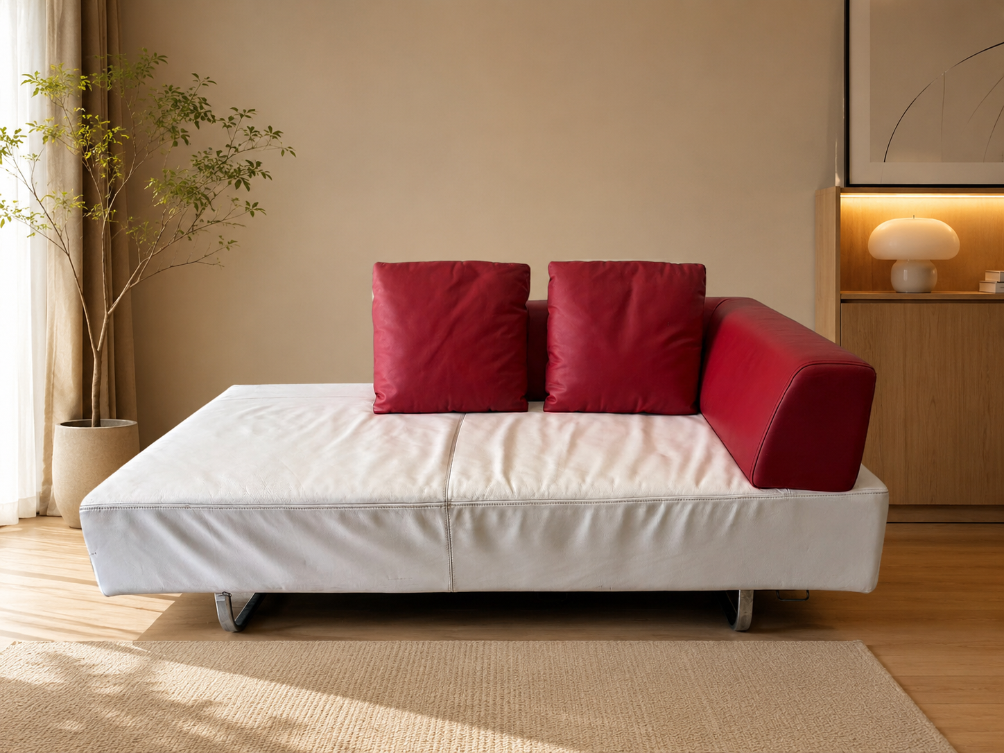 White daybed sofa with red trim, modern style.
