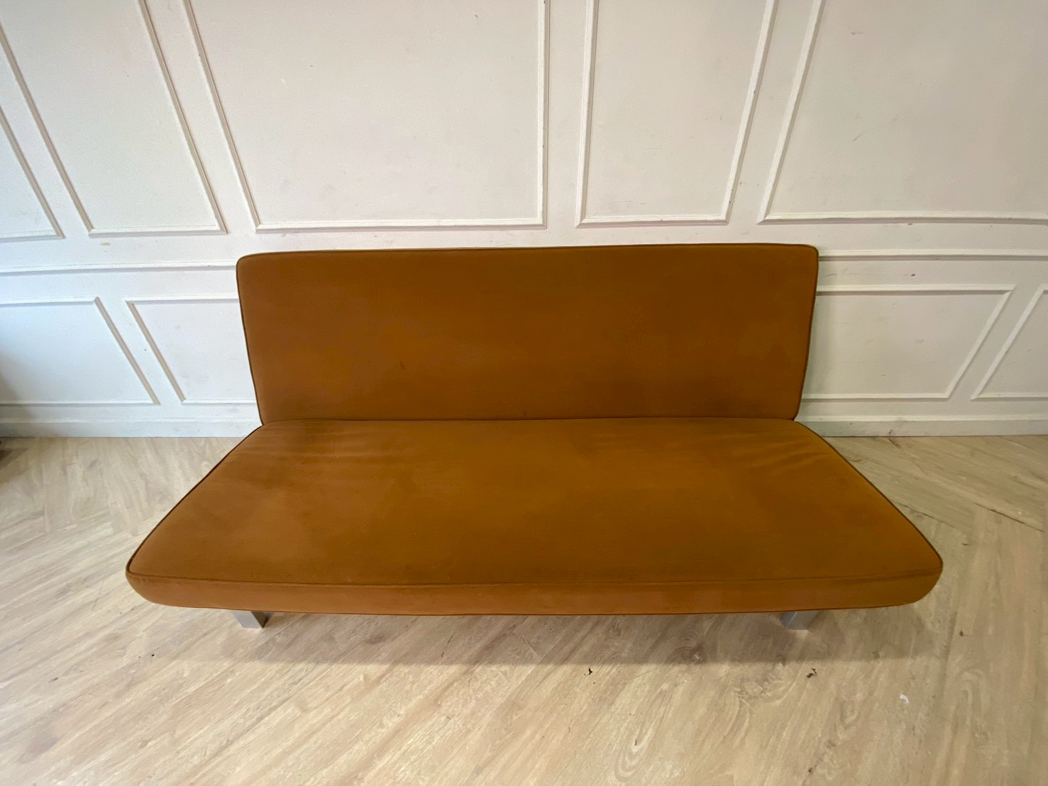 Two-seater sofa bed upholstered in orange fabric, 187 cm.