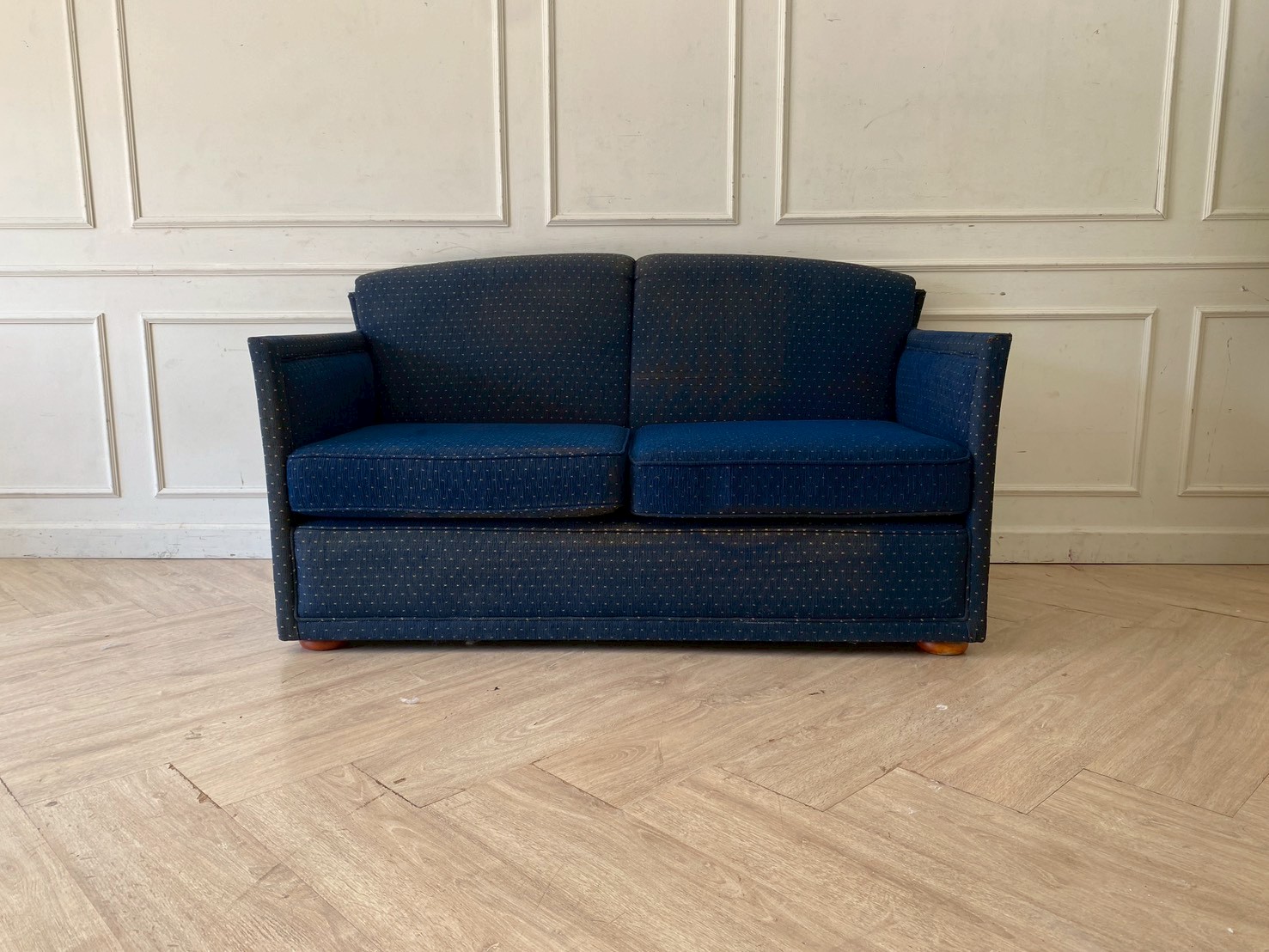 Two-seater sofa, fabric upholstery, blue color.