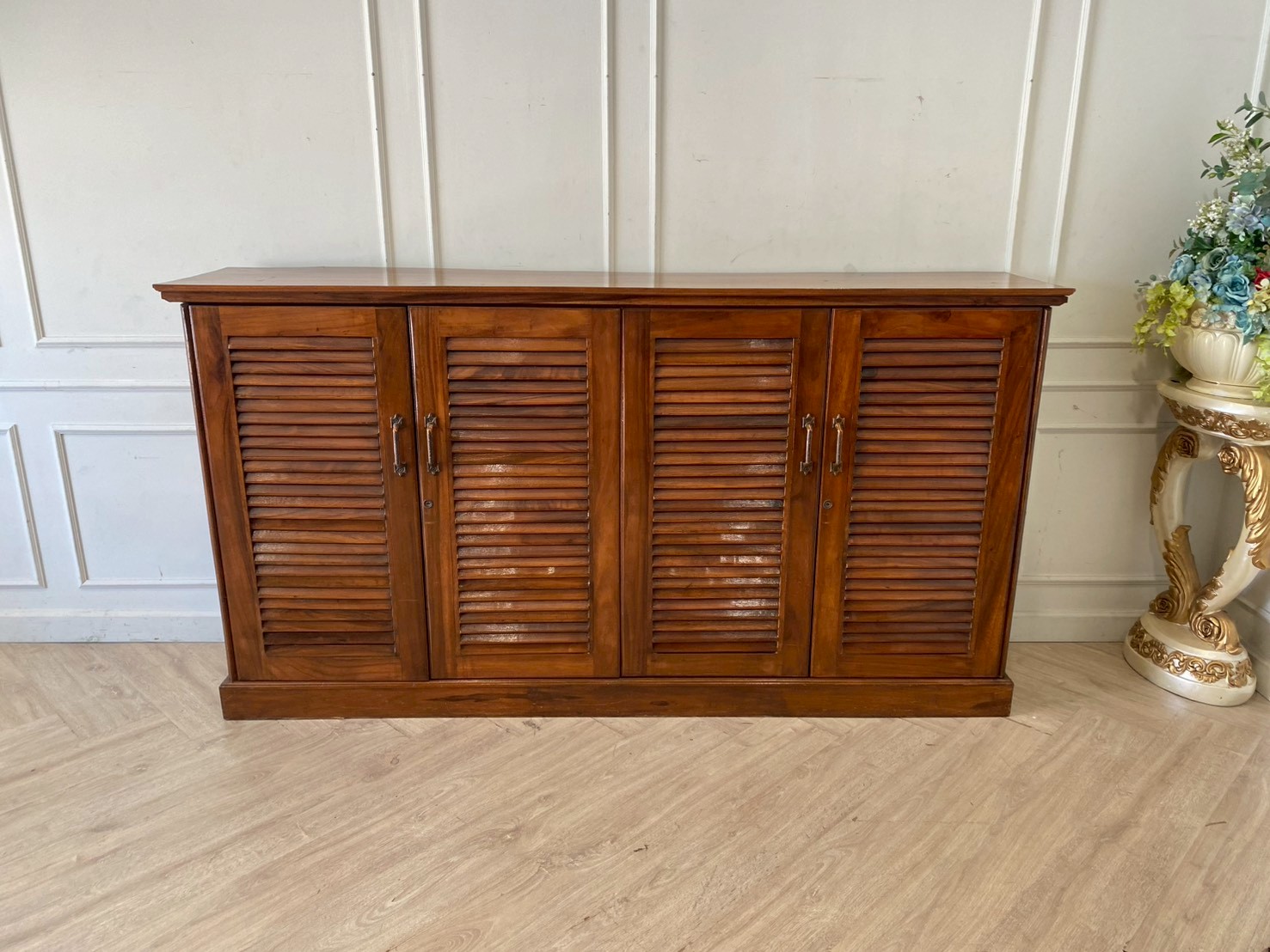 Teak wood shoe cabinet with 4 doors and 7 shelves, brown color.