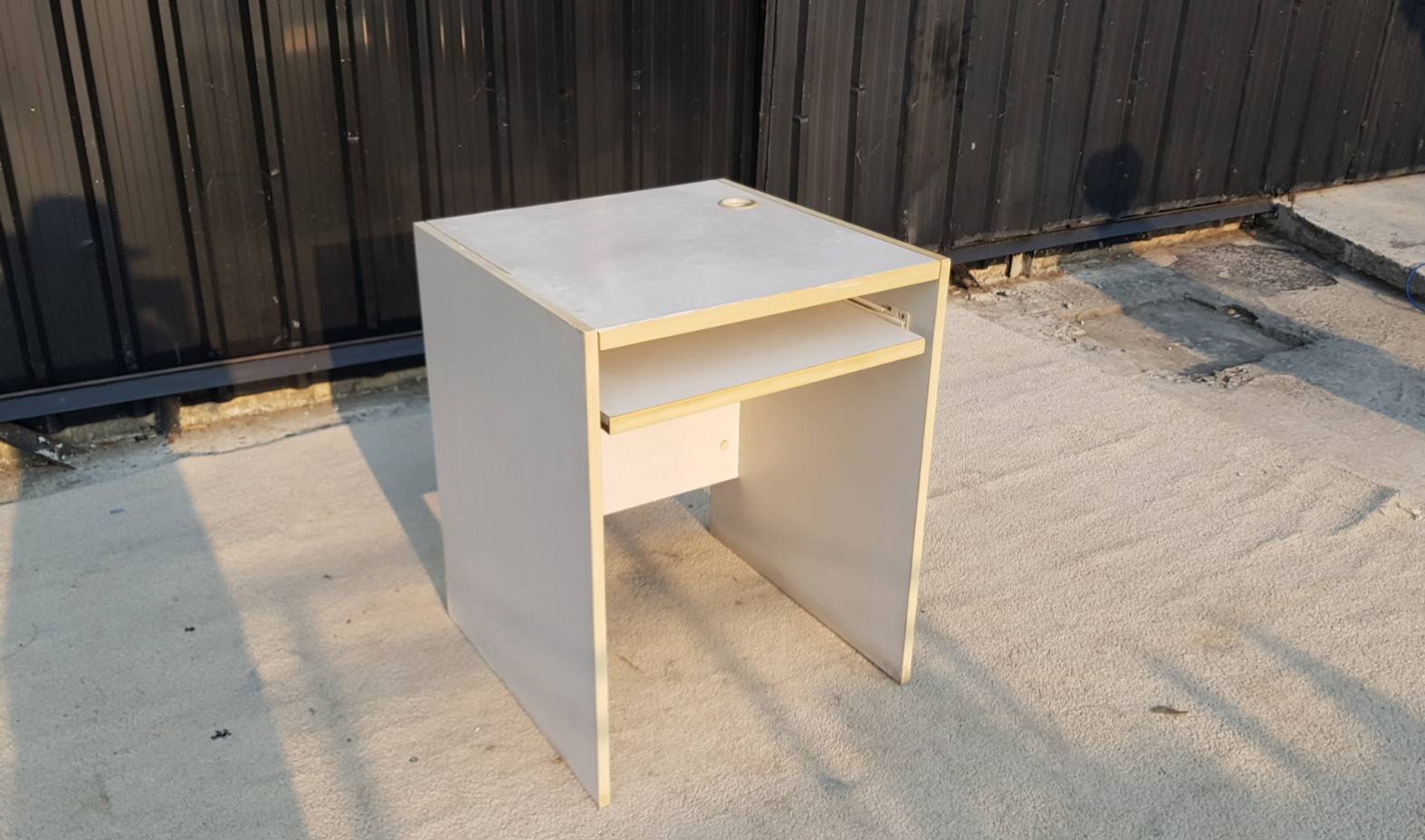 Wooden computer desk, gray color.