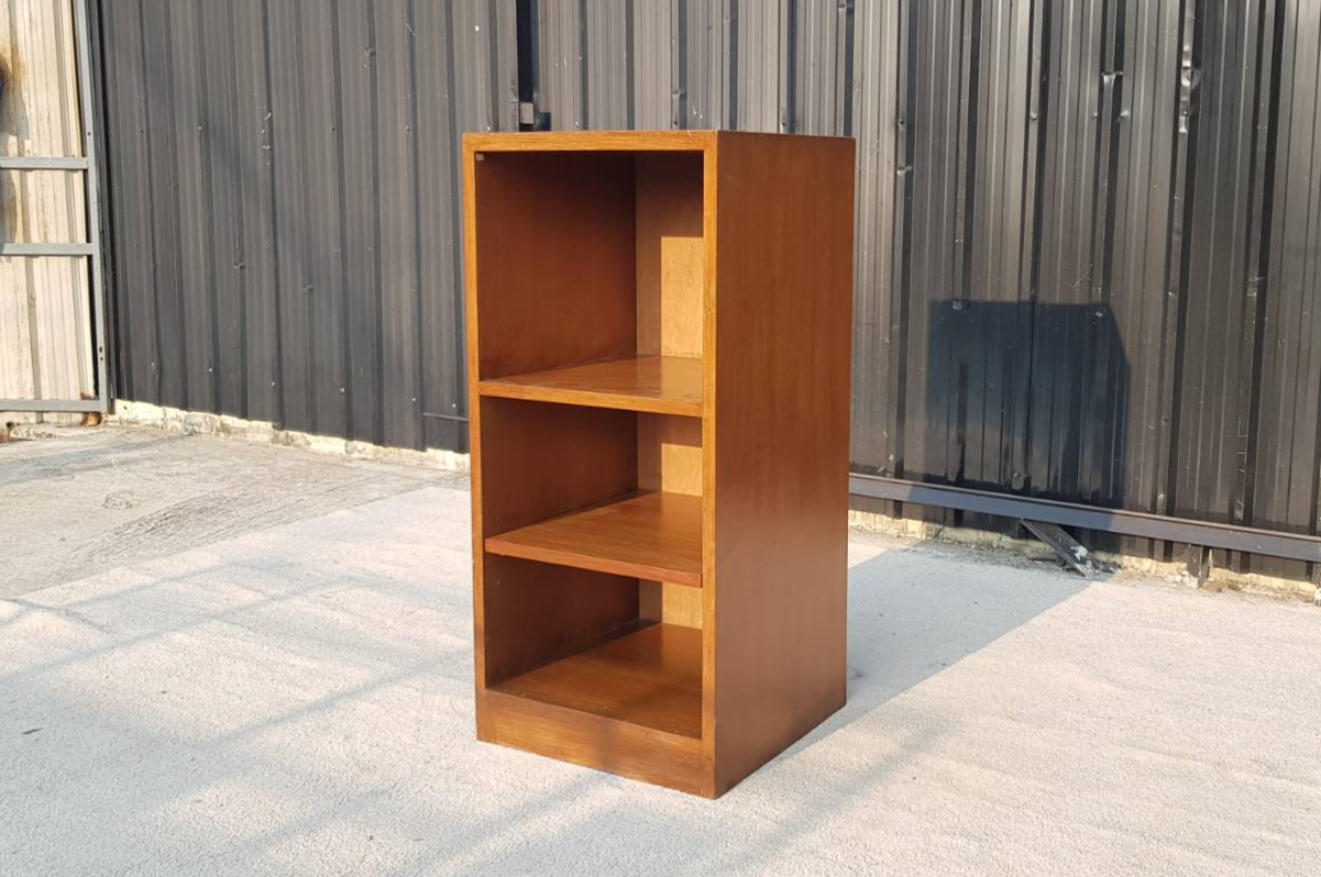 Three-tiered wooden cabinet, brown color.