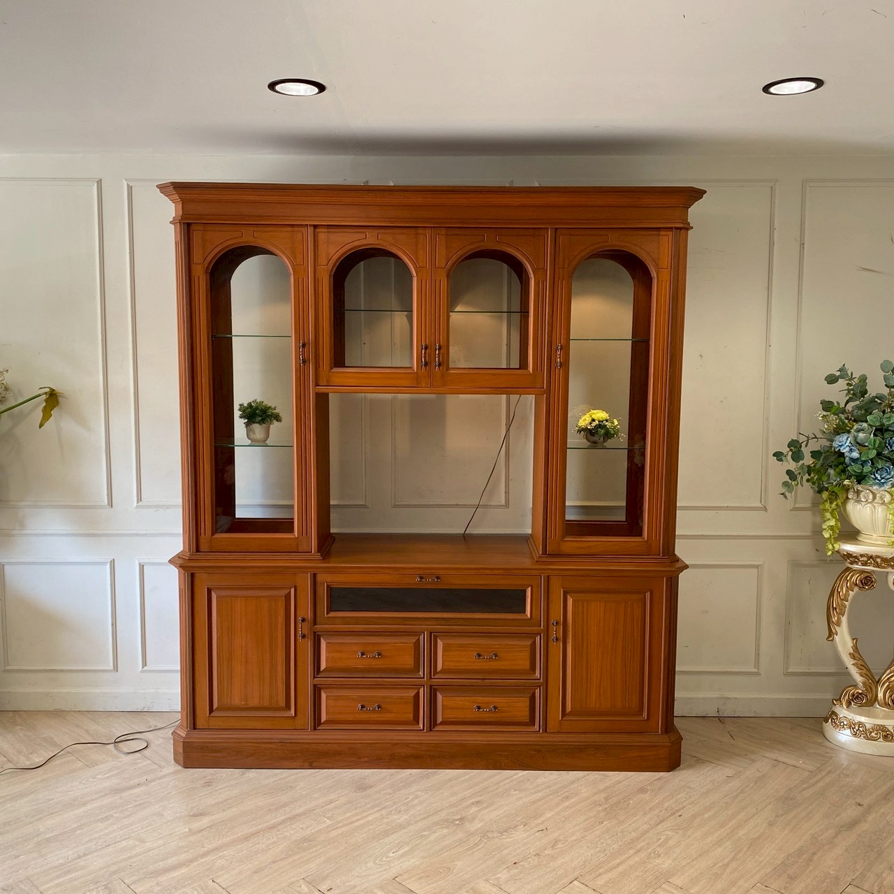 Vintage style teak wood display cabinet with 7 doors and 4 drawers.
