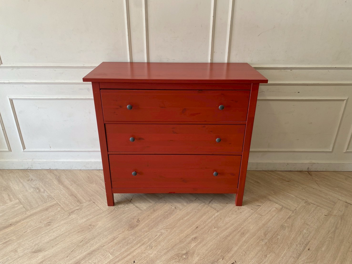 Wooden storage cabinet with 3 drawers, red.