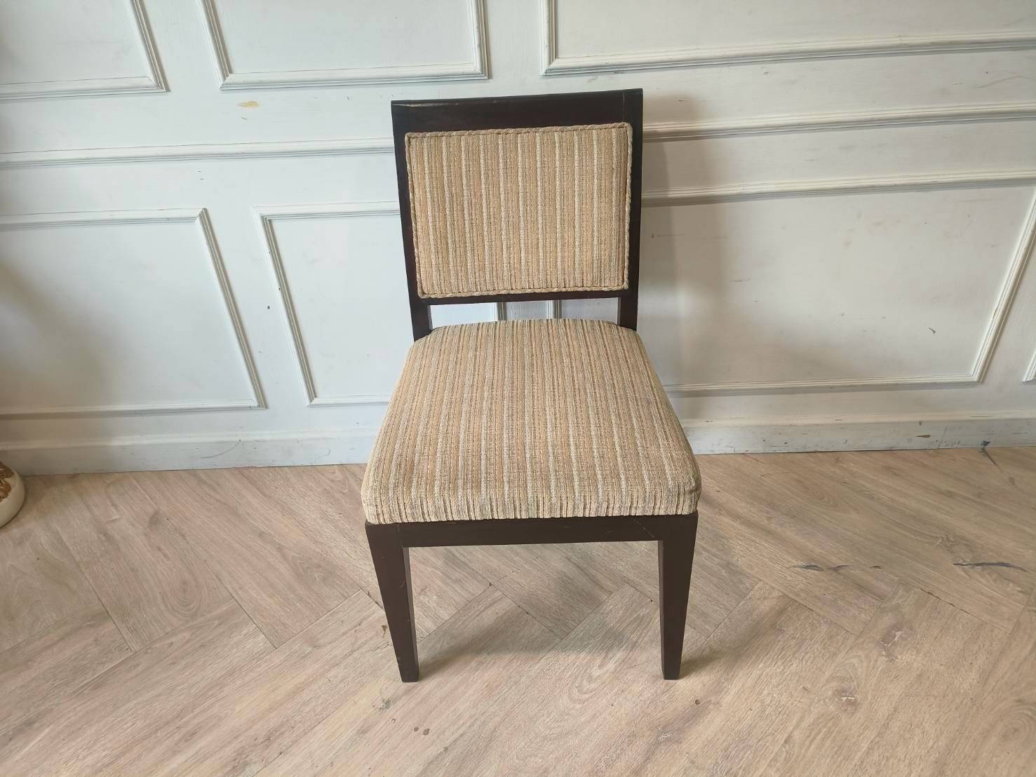 Wooden chair, cream-colored fabric cushion with straight lines. Beautiful frame, dark brown. The backrest has a cushion.