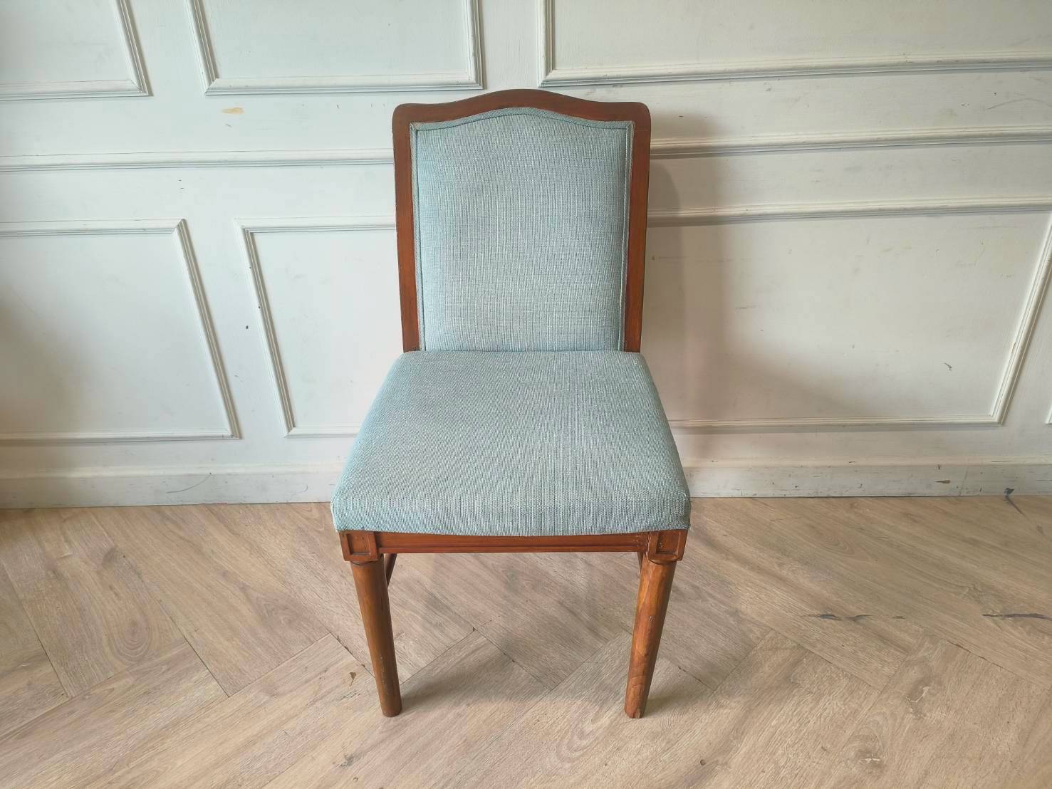 Light blue fabric wooden chair, beautiful design.