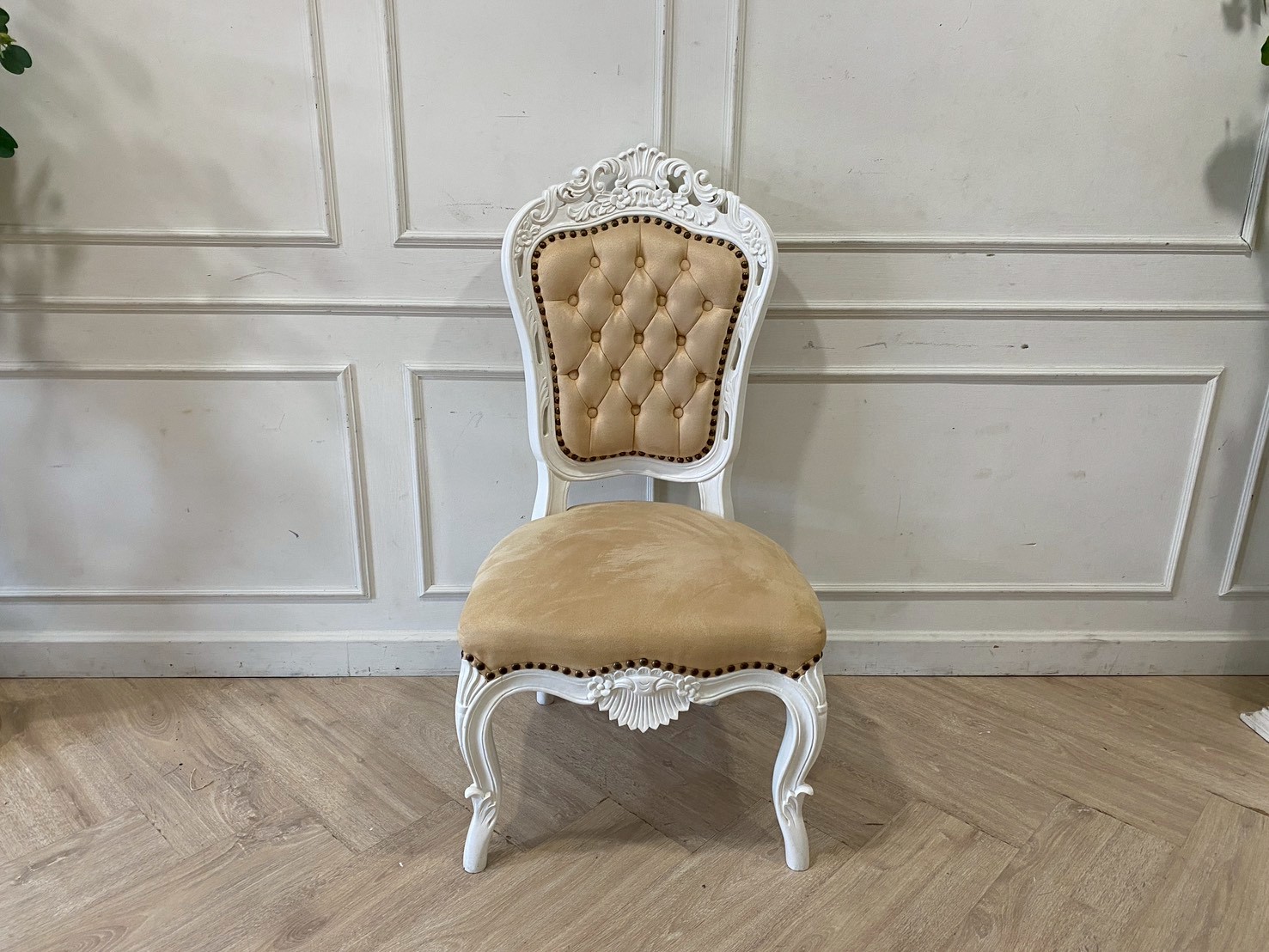 Single-seat Louis-style wooden chair with yellow button-tufted fabric upholstery.