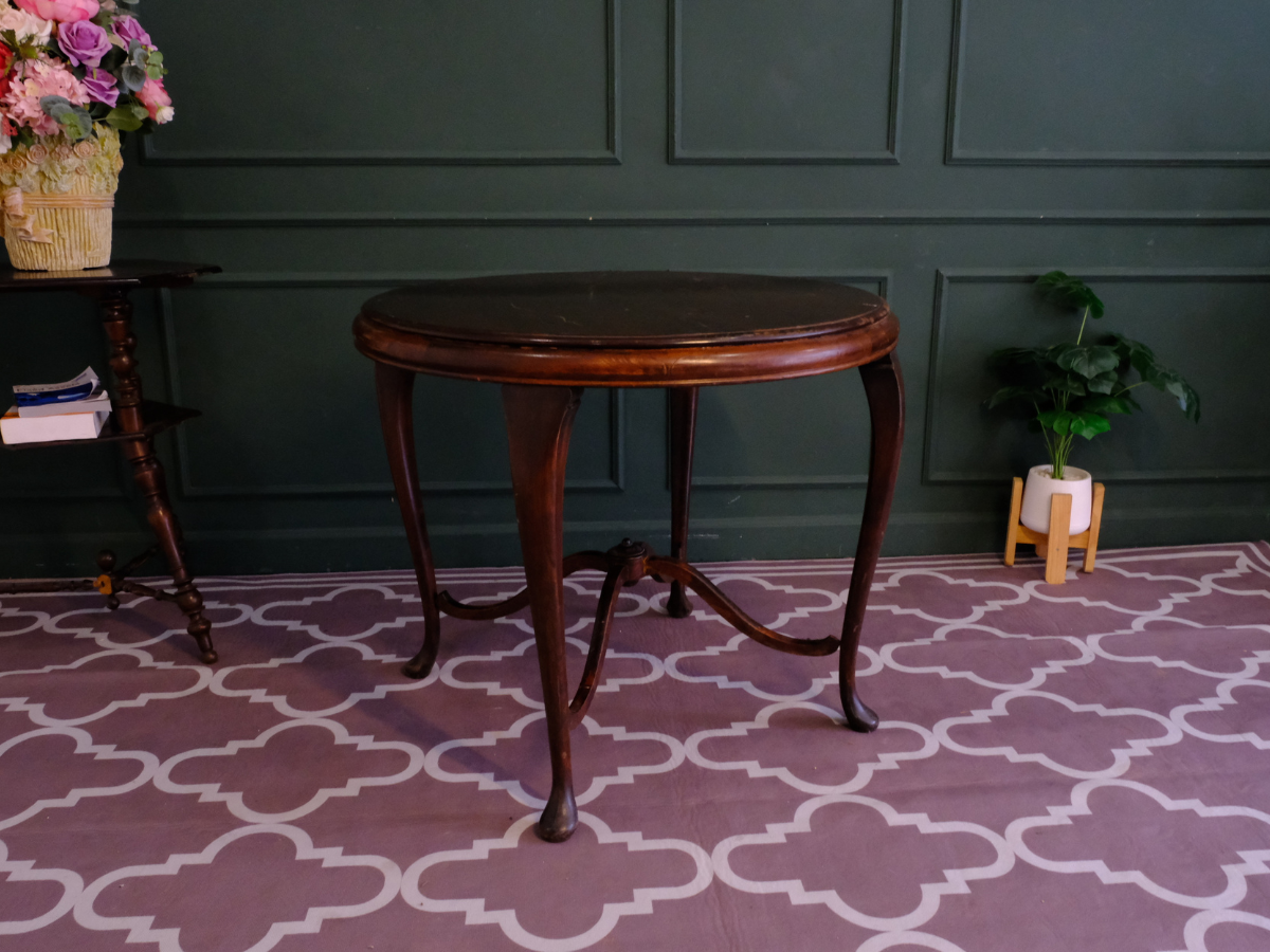 Round table, carved wood European work comes from Germany.