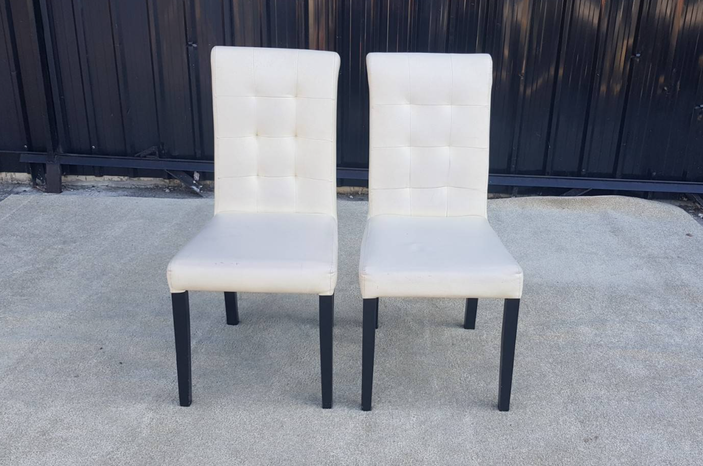 Wooden leg chair with cream leather seat.