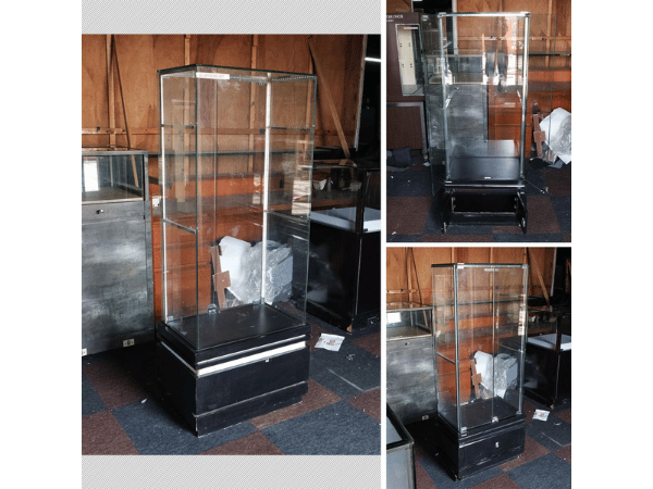 Jewelry cabinet, glass cabinet to display products Tall, square shape glass door open Black wooden base with white stripes