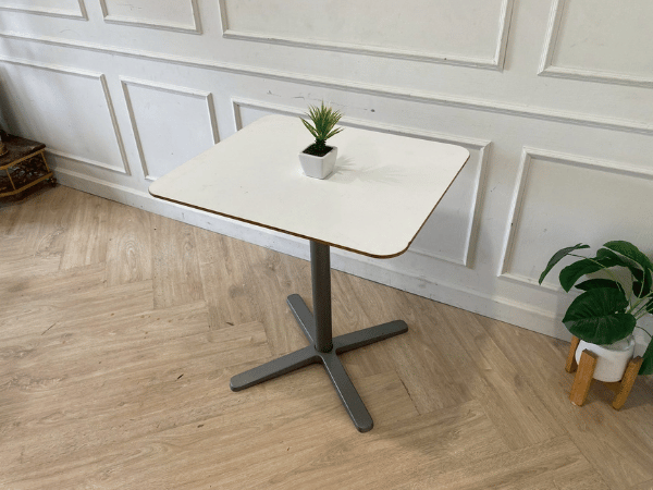 White wooden table, gray steel legs